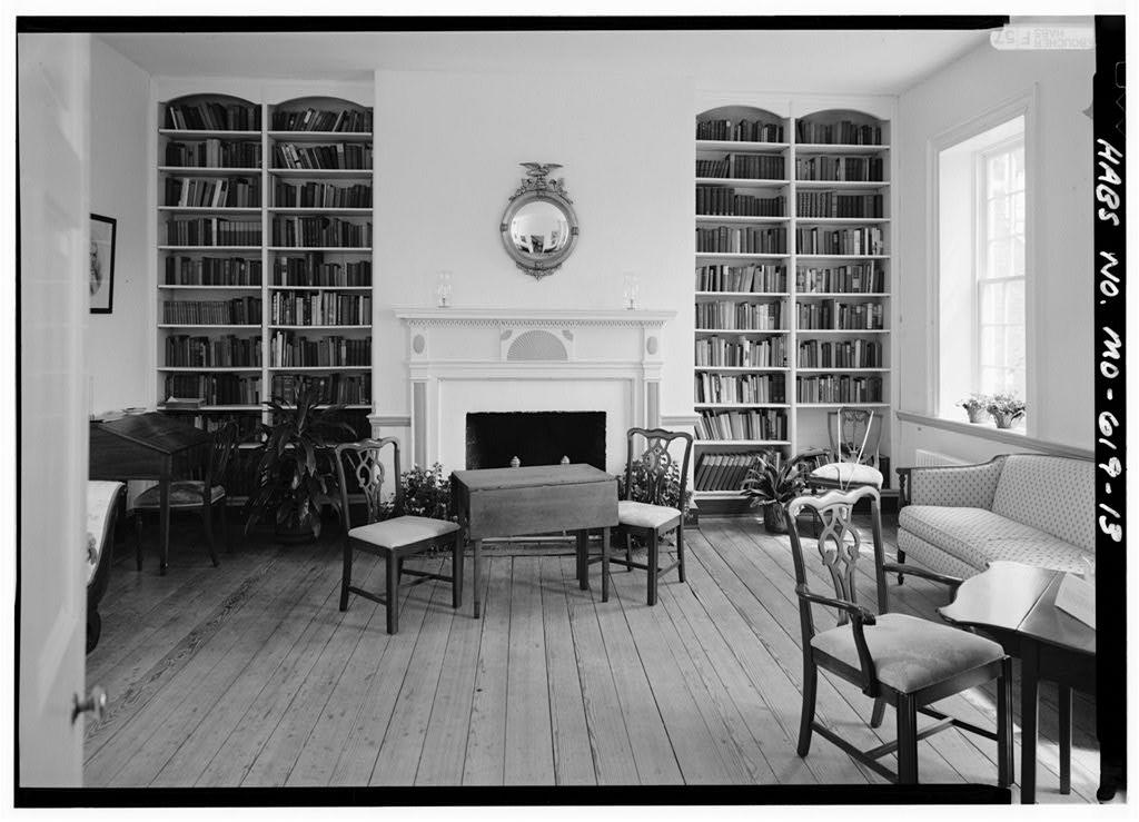 Interior Room with book shelves in the back and seating in the front. 